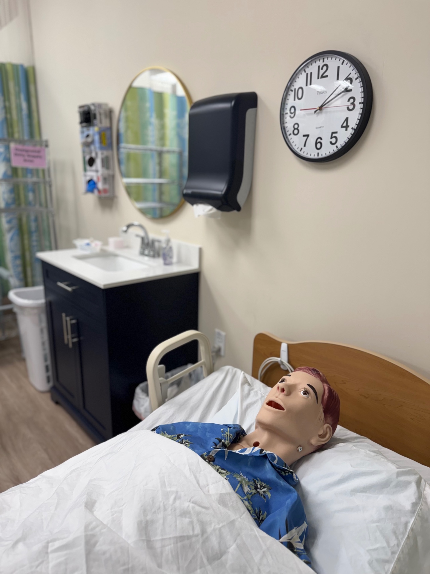 Inspire CNA School skills lab with hospital bed and clinical training equipment